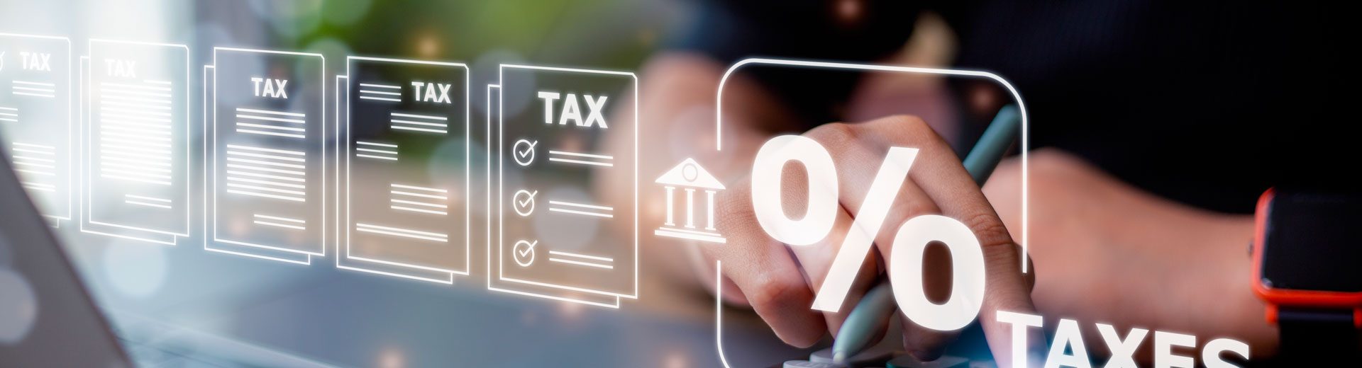 Person calculating taxes on a calculator