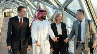 Diverse business group walking in modern corridor in Dubai