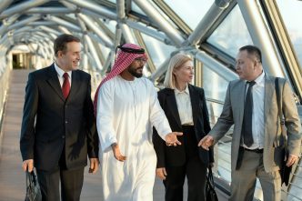 Diverse business group walking in modern corridor in Dubai