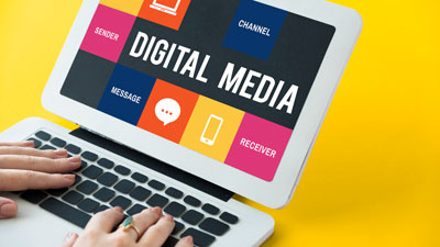 Laptop displaying digital media concepts.