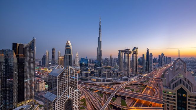 Dubai skyline with Burj Khalifa at sunset.