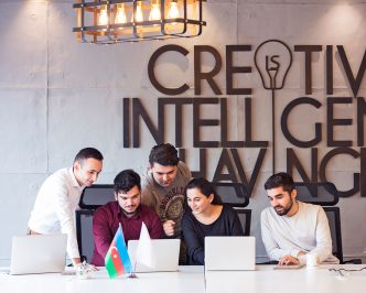 UK startups - Team collaborating in modern office workspace.